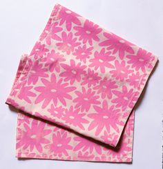 two pink napkins sitting on top of each other