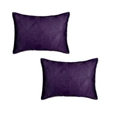 two purple pillows sitting next to each other