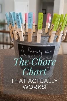 a bucket full of clothes pins with the words, the chore chart that actually works