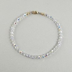 Add some sparkle into your life with this clear crystal anklet that sparkles like diamonds. Made with small 4mm clear Aurora Borealis crystals and fastens with a 14k gold filled lobster clasp. Choose the size anklet you need from the drop-down menu, bearing in mind that the anklet should be approximately one inch larger than the size of your ankle. The anklet will arrive in an attractive gift box. Anklet Bracelet Crystal, Adjustable Crystal Anklets In Elegant Style, Adjustable Gold Crystal Anklets, Dainty Adjustable Nickel-free Anklets, Adjustable Nickel-free Crystal Bracelet, Crystal Anklet, Aurora Borealis Crystal, Lobster Clasp, Anklet Jewelry