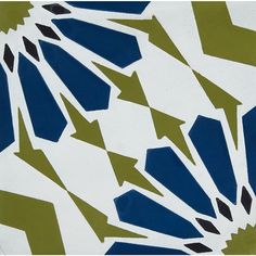 an artistic tile design with arrows in blue, green and white