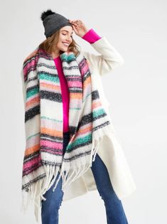 Add a pop of color to your winter wardrobe in the Helen Scarf. This scarf features a multi color stipe pattern in green, magenta, orange, pink, lilac, and ivory and a fringe trim, giving this classic silhouette a lively update. Made from polyester, the Helen Scarf is sure to keep you cozy while brightening up any dull winter day. Color: Multi L 75" X W 30" Polyester Made In China Vegan Cozy Scarf, Slouch Hat, Fall Winter Wardrobe, Faux Fur Pom Pom, How To Make Handbags, Winter Looks, Winter Wardrobe, Holiday Outfits, Lifestyle Brands