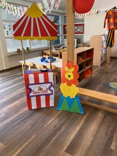 children's playroom with wooden flooring and colorful umbrellas in the background