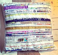 a pillow made out of old newspaper strips