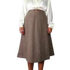 Absolutely Stunning Vintage A-Line Mini Skirt. Tan Mocha Brown Knit High Rise A-Line Skirt. Formal Vintage Skirt, Union Made with 1959-1963 ILGWU Union Label. Chic Belt Buckle Detail, Twee Retro Glam Skirt 1960s Classic *  Tagged VTG. Size 10, Waist Approx. 26" *  Material Unknown, Knit with Silky Lining *  American Vintage Union Made In The U.S.A.  *  Excellent Condition, Gently Worn  Approximate Measurements; Not Exact   * Waist Approx. 26" * Length Approx.  26.5" 📦  Bundle Discounts on Multi Chic Brown A-line Skirt, Formal Midi Skirt, Vintage Brown Knee-length Skirt, Retro Brown Skirt With Button Closure, Vintage Cotton Brown Skirt, Vintage Brown Wool Skirt, Steam Punk, Kate Upton, Union Made