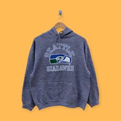 Vintage 90s Seattle Seahawks hoodie Seattle Seahawks sweater pullover streetwear sports style college university Gray colour size large by YoungmodernCo on Etsy Seattle Seahawks, Sport Fashion