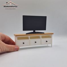 Who does not know this TV cabinet of a famous store.  Now it can also be ordered in miniature  All drawers can open and close, useful to store your small stuff.  Price applies to the TV cabinet only. TV and accessories can be ordered separately Primary color = Cabinet color  Secondary color = Top color  Personalization = Button color  Dimensions : 12,5 cm wide x 3,4 cm deep x 4,9 cm high ❤ Modern dollhouse furniture and accessories ❤ In 12 colors (combinations) possible  ❤ High quality 3D print Dollhouse Dresser, Dollhouse Cabinet, Modern Dollhouse Furniture, Colors Combinations, Dollhouse Projects, Small Stuff, Modern Dollhouse, Tv Cabinet, Doll Furniture