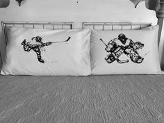 black and white photograph of two pillows on a bed with an image of skiers