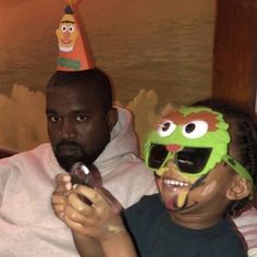 a man and a child wearing birthday hats