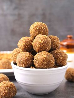 a white bowl filled with peanut butter balls