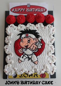 a birthday cake with an image of a cartoon character on the frosting and red roses