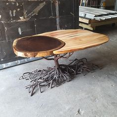 a table made out of tree trunks and branches