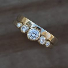 three diamond rings sitting on top of each other