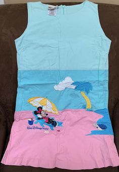 DISNEY WORLD KIDS DRESS SIZE L TROPICAL MINNIE MOUSE BEACH LIFE SUPER CUTE!!. Light stain on front see pic. Probably wash out Multicolor Disney Dresses For Summer, Casual Summer Dress With Minnie Mouse Design, Disney Multicolor Summer Dresses, White Minnie Mouse Summer Dress, Summer Cotton Disney Dresses, Summer Disney Cotton Dresses, Multicolor Disney Summer Dresses, Disney Cotton Summer Dress, Cute Minnie Mouse T-shirt For Summer