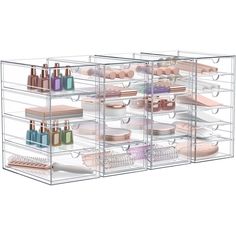 three clear shelves filled with cosmetics and other items