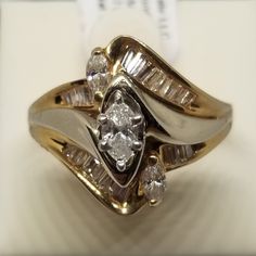 "Vintage 14K Yellow Gold Est 1 Tcw Diamond Ring, Size 7. Inside the band is marked © A66 14K. No missing stones. Weighs 4.1 dwt. We do not check prongs for wear or stones for looseness. All items are sold as is-noting that we are a resale shop so everything here had a previous owner! We will include flaws in the description when noted. This is one of the reasons our items are more affordable than new at a jewelry store. Are these stones real or fake? Aside from diamonds, we do not know if any ge Stamped 14k Marquise Cut Ring For Anniversary, 14k Stamped Marquise Cut Ring For Anniversary, Gold Bypass Ring With Diamond Cut For Anniversary, Gold Diamond Cut Bypass Ring For Anniversary, Marquise Cut White Gold Ring Stamped 14k, Classic Diamond Cut Bypass Ring For Anniversary, Vintage Wedding Jewelry, European Jewelry, Vintage Jewellery Rings