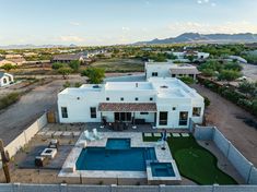 an aerial view of a house with a swimming pool