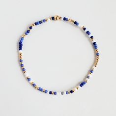 I added a pop of colour to my Classic gold bead bracelet and it is the perfect addition to a dainty stack. The beads are strung on a premium stretch cord. You will love this blue Shades MixSOLD BY ONE BRACELET or Set of fourITEMS DETAILS:Water Resistant -Nickel-free - Allergy-free- 18K gold plated brass beads made to last- round bead size: 2mm- Glass seed beads 2mm- stretchy elastic cord, no clasp, designed to fit wrist sizes from 6 - 7 inches Green Bead Bracelet Diy, 2 Mm Bead Bracelet, Blue Seed Bead Bracelet, Diy Bracelet Designs Beads, Blue Bracelet Ideas, Seed Bead Bracelets Ideas, Blue Beads Bracelet, Miyuki Beads Bracelet, Beaded Diy