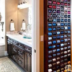 the bathroom is decorated in shades of blue and brown, with lots of storage space