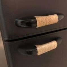 two black drawers with twine wrapped handles