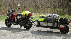 a motorcycle with luggage on the back is parked