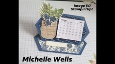 an image of a desk calendar with flowers in a vase on it and the words, imagine c stompin'up