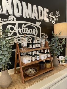 an assortment of products on display in front of a sign that reads handmade and artisan