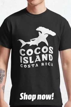 a man wearing a black t - shirt that says cocos island costaricaca