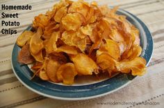 a blue plate topped with potato chips on top of a table