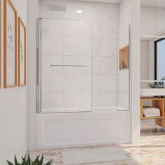 a white bathroom with a glass shower door and tile flooring, along with a potted plant in the corner