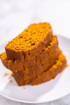 two slices of pumpkin bread on a white plate