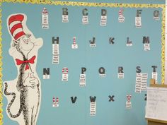 the cat in the hat bulletin board is decorated with letters and numbers, including an image of dr seuss