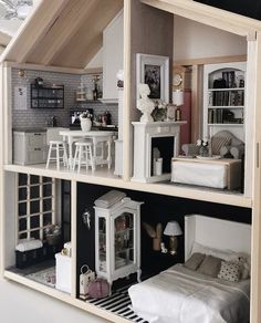 a doll house with furniture and accessories in it