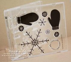 a clear plastic box with snowflakes and mittens on it