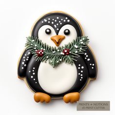 a decorated penguin cookie sitting on top of a table