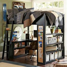 a bunk bed with a desk underneath it and bookshelves on the bottom floor