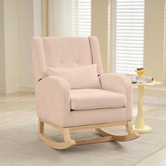 a baby's rocking chair in a living room