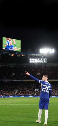 a man standing on top of a soccer field