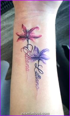 a woman's wrist tattoo with three flowers and the word love on it,