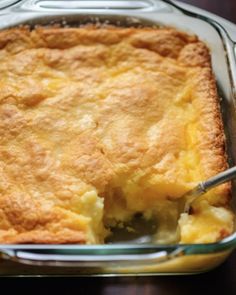 a casserole in a glass dish with a serving spoon on the side, ready to be eaten