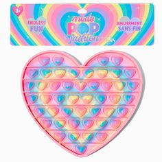 a pink heart shaped object with lots of hearts on it's side and an ad for