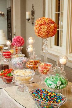 a table filled with lots of different types of candy and candies on top of it