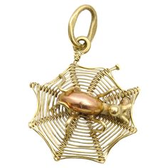 This is a 14 karat gold vintage spider web charm. This adorable spider web charm is beautifully made with a rose gold spider in the center spinning its web to catch delicious insect meals. Charms are great to collect as wearable memories, it has a symbolic and often a sentimental value. This vintage charm can be added to your necklace, charm bracelet or layered with your other favorites. The charm is in very good condition and of high quality. It measures 2.3 cm in length including bail and 1.5 Vintage Spider, Halloween Charms, Necklace Charm, Beautifully Made, Spider Web, Vintage Charms, Charm Pendant, Or Rose, Jewelry Necklace Pendant