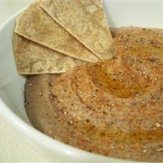 a white bowl filled with tortilla chips