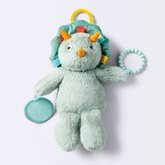 a stuffed animal with a pacifier in it's mouth on a white background