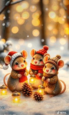 three little mouses are sitting in the snow