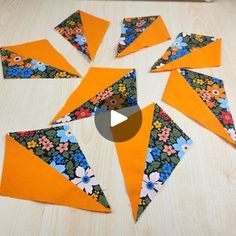 a video demonstrating how to make an origami flower arrangement with fabric and paper