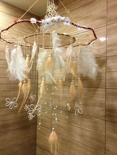 a white dream catcher hanging from the ceiling