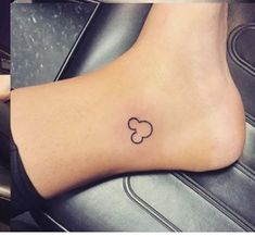 a small tattoo on the foot of a woman's left foot, and an image of