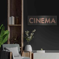 a living room filled with furniture and a sign that says cinema on the wall above it